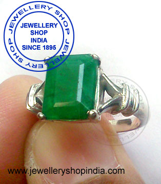 Emerald Gemstone Ring Designs with diamonds for ladies